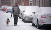 PHOTOS: Snow bomb hits UK, road, air travel disrupted