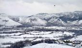 PHOTOS: Srinagar turns white after season's first snowfall