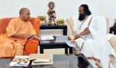 Sri Sri meets Adityanath day before visiting Ayodhya