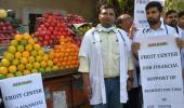 Why are these doctors selling fruits?