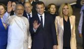 With handshake and hug, PM Modi welcomes Macron at airport