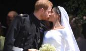 Sealed with a kiss! Harry and Meghan are husband and wife