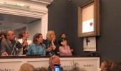 Banksy painting 'shreds itself' after being sold for $1.4 million