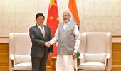 What was Xi Jinping's confidant doing in India?