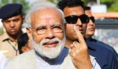 PM Modi votes, says 'voter ID' more powerful than IED