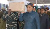 PIX: Rajnath helps carry coffin of slain CRPF jawan