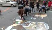 PIX: Jamia students paint road with anti-CAA graffiti