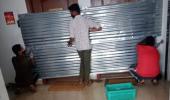 Officials seal houses with metal sheets in Bengaluru