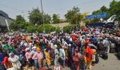 Hoping to go home, migrants walk to rlwy station daily