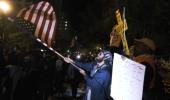 As US counts votes, protesters take to the streets