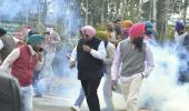 Facing water canons, tear-gas, farmers push to Delhi