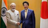 Eyeing China, Japan signs military pact with India