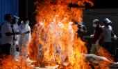 Woman jumps on father's pyre during Covid cremation