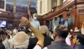 Opposition MPs climb on table, throw papers in RS