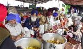 Cold night, drizzle fail to deter protesting farmers