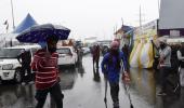 Overnight downpour, biting cold fail to deter farmers