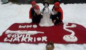 Kashmiri sisters' tribute to corona warriors in snow