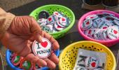 Selling badges: Business thrives at farmers' stir