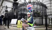 Why is he on a potty outside Boris' home?