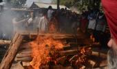 Kashmir: Slain principal cremated amid protests