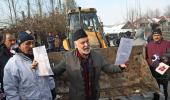 J-K officials raze outer walls of ex-minister's house