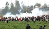 Farmers forcibly move barricades, cops fire tear gas