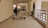 MP official suspended after farmer 'rolls on floor'
