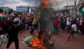 Netanyahu in Congress, protestors burn US flag outside