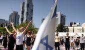 Amid war, hundreds join Yoga Day events in Israel