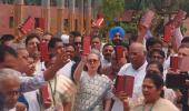 Oppn protests in Parl with Constitution copies in hands