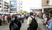Phone still rings: AI crew staffer's family holds on to hope