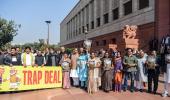 Opposition calls US trade pact a 'trap deal', steps up protest