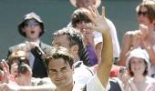 Federer downs Karlovic to reach semis