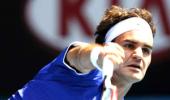 Federer eases into home-town quarter-finals