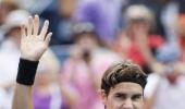 Below par Federer stops Hewitt in four sets