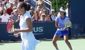 Sania out of doubles, Bhupathi advances