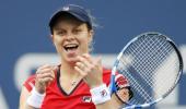Comeback mum Clijsters stuns Venus