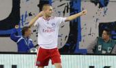 Hamburg down Bayern to stay top