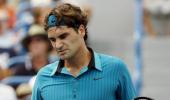 Federer shakes off rust to advance in Toronto