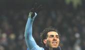 Tevez hat-trick fires City into the top four