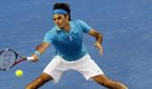 Federer awakes from slumber to beat Davydenko