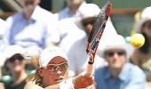 Bartoli ousted at Stanford, Stosur battles on