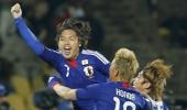 Japan stun Denmark to go through