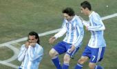 Tevez double puts Argentina in last eight