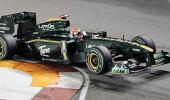 Lotus F1 team boss torn over name change