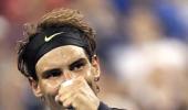 Nadal eases through after Djokovic struggles