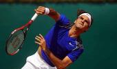 Federer roars through in Monte Carlo clay debut