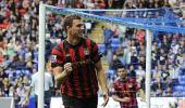 Silva service lifts City top with win at Bolton