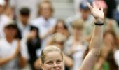 Clijsters survives scare to progress in Paris