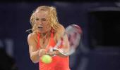 Wozniacki through after Chakvetadze retires